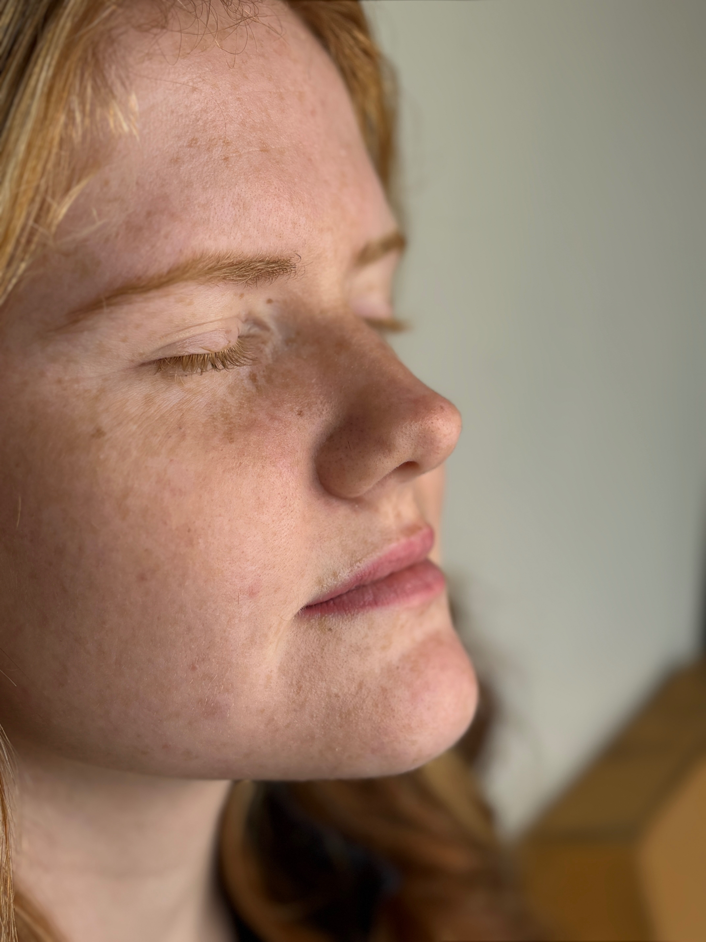 Client lip blush result — side profile
